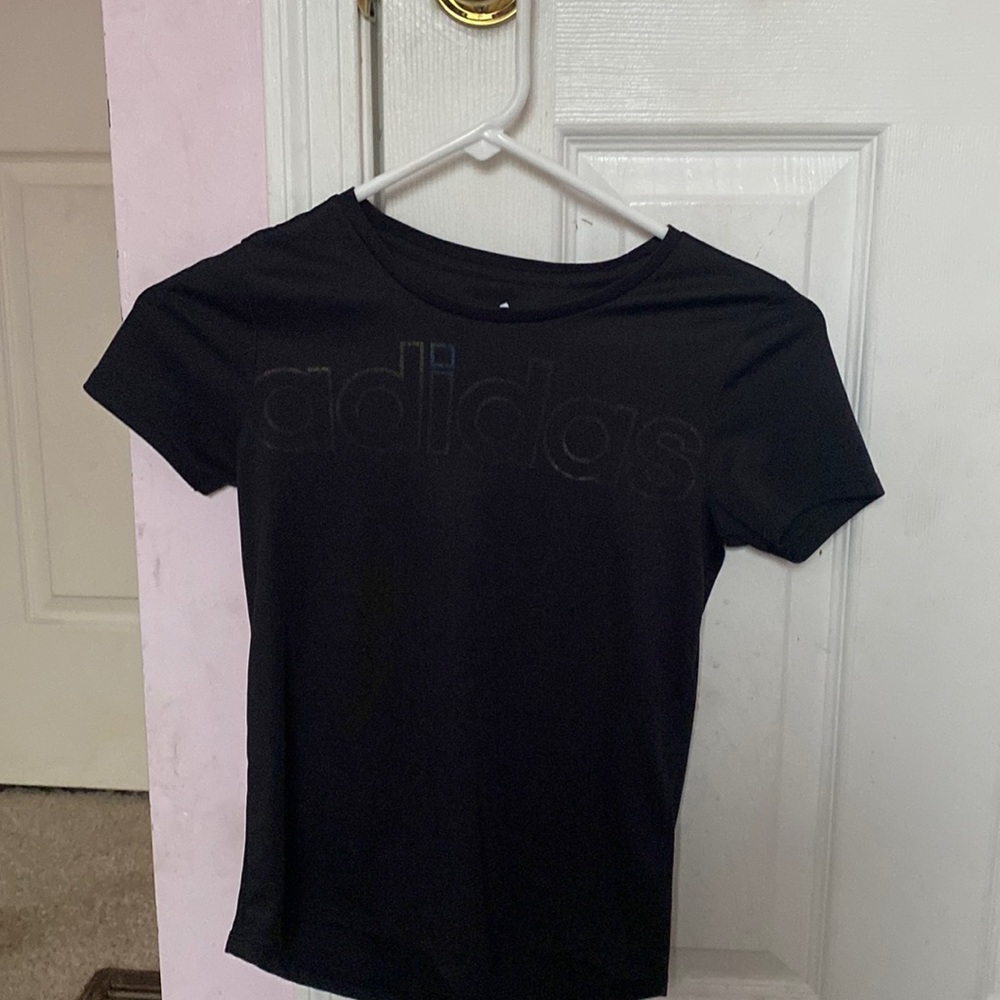 Black t-short with rainbow text that says "adidas"